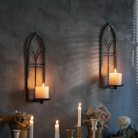 white wall mounted candle holders